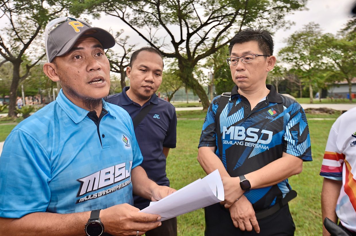 Mohd Ariffuddin (left) and Yap (right) speaking to the media on the theft of electrical parts at Taman Wawasan Recreational Park in Puchong.