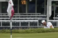 Golf-Johnson shakes off quadruple-bogey to stay in U.S. Open hunt