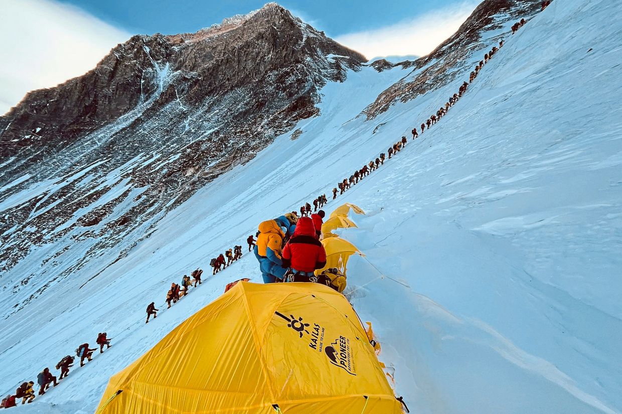 The interest to climb Mount Everest is growing so much that ‘traffic jams’ have become common. — AFP