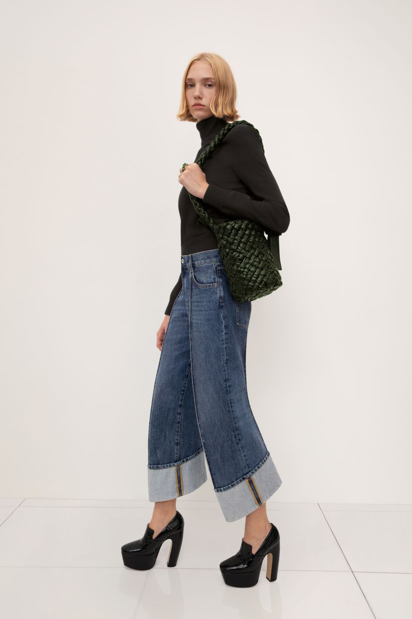 Jeans with a retro style from worn with a black turtleneck for a look that’s funky yet contemporary. Photo: Bottega Veneta
