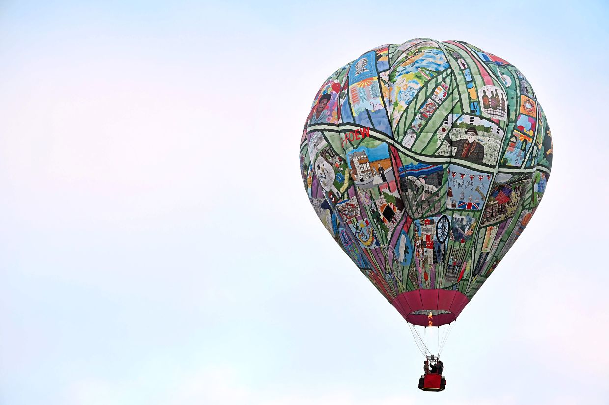 A hot air balloon during the Midlands Air Festival in Birmingham, England recently. Richard Branson once crossed the Pacific Ocean in one of these vessels. — AFP