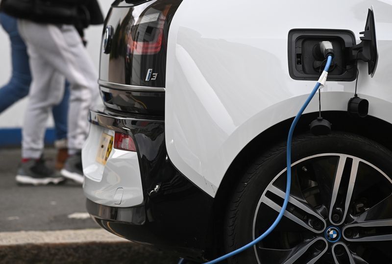 An electric car is charged at a roadside EV charge point London October 19 2021. REUTERSToby MelvilleFile Photo