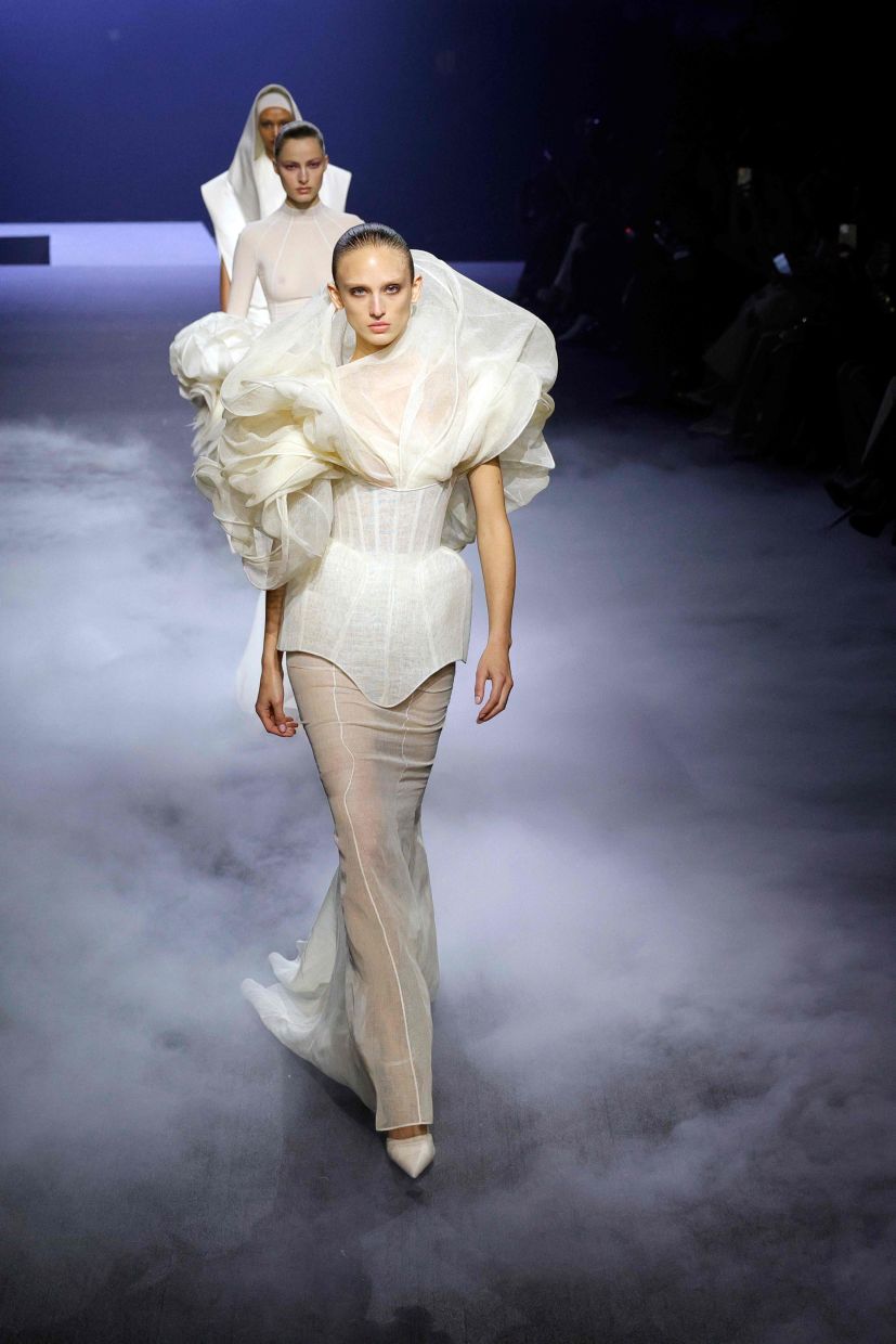 Soft, raomantic designs were shown by Ashi on the runway. Photo: AFP