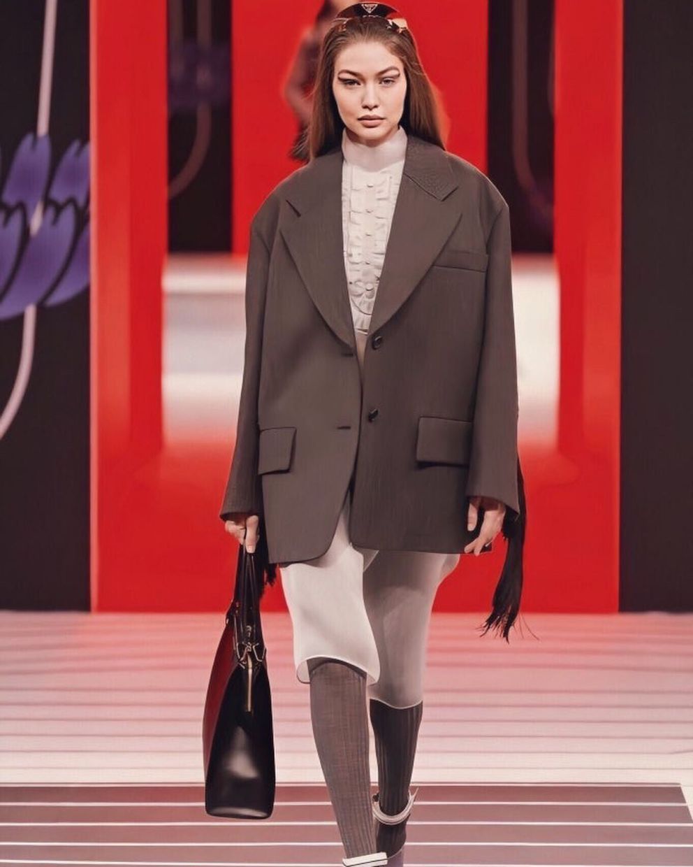 Gigi Hadid models an ensemble topped off with a slouchy brown blazer on the Prada runway. Photo: Instagram/Gigi Hadid