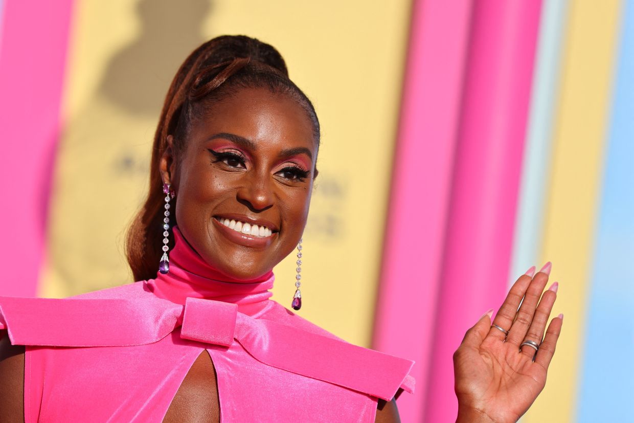 Issa Rae’s makeup includes a matte lid with a cut pink crease, an angled black wing, and visible lash. — Reuters