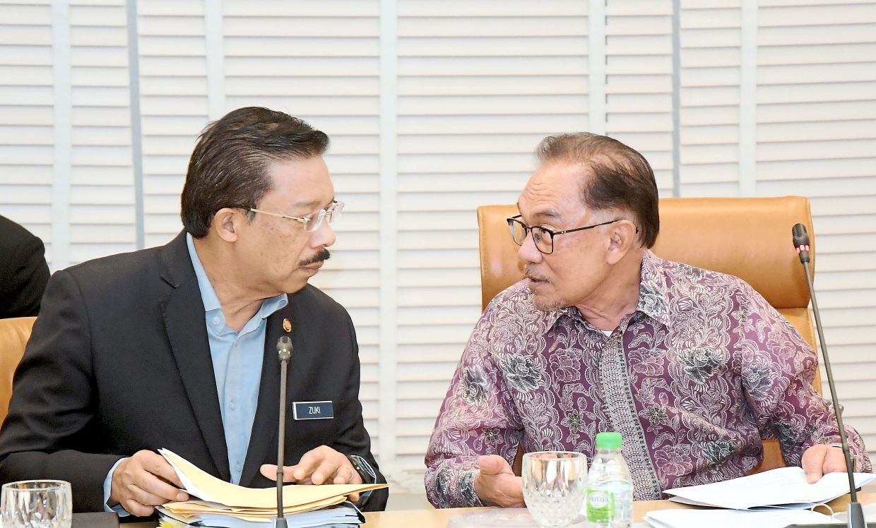 Mohd Zuki (left) speaking with Anwar during a special meeting on the economy in November last year. Whoever becomes the next chief secretary to the government must be up to the important task of serving as the bridge between the civil service and the government of the day. — Prime Minister’s Office