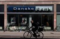 Danske Bank raises profit forecast on rising interest income
