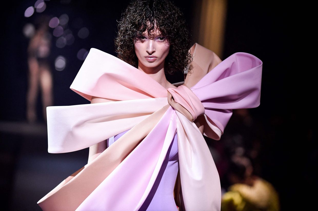 Viktor & Rolf unveiled a collection of couture swimsuits, each embellished to the max. Photo: AFP