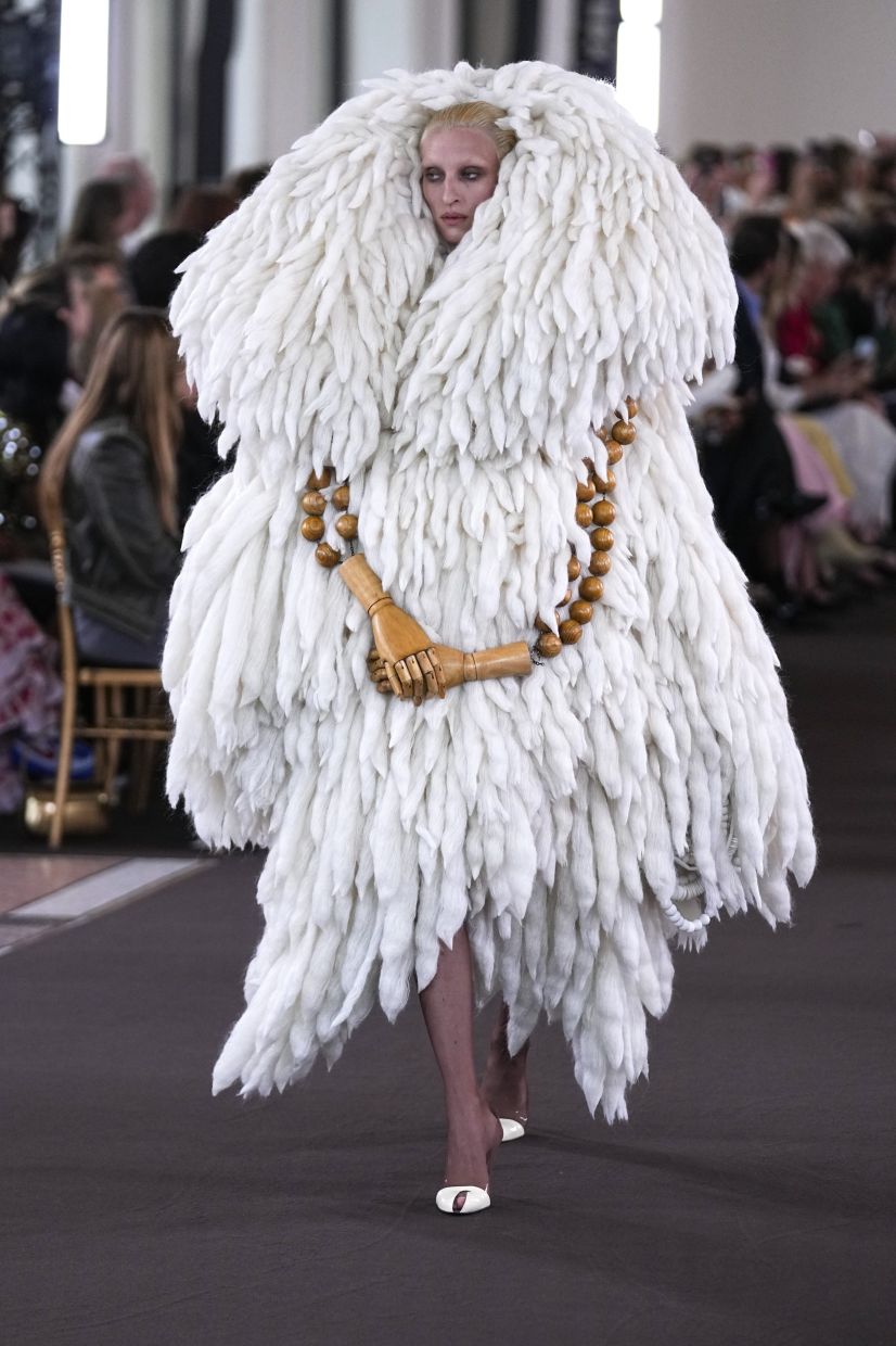 Schiaparelli's designs were surreal, like this one with additional arms added on. Photo: AP