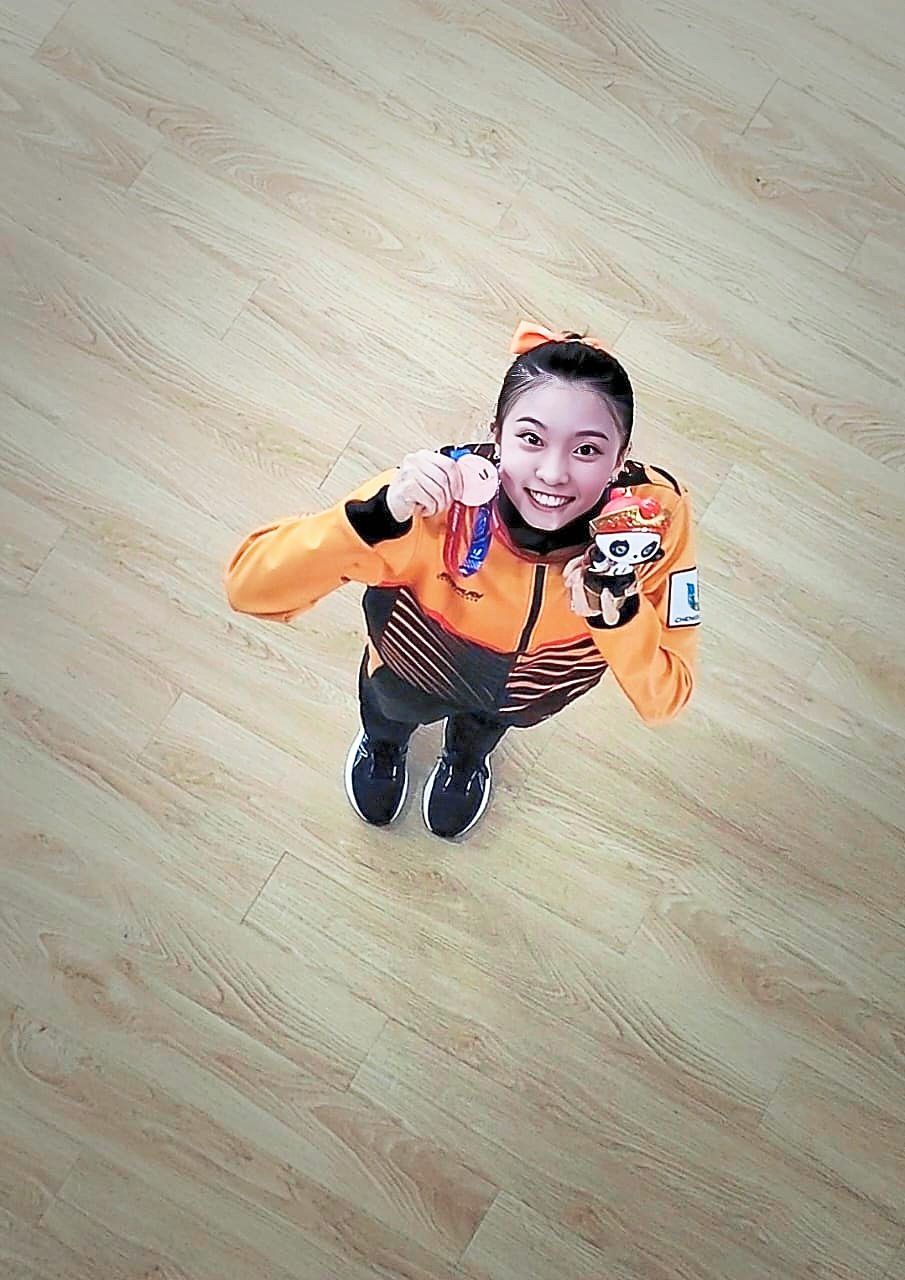 View from above: Mandy Cebelle Chen posing with her bronze medal.