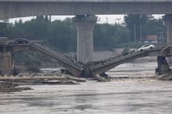 Highway bridge in northern China collapses due to flash floods, casualties unknown