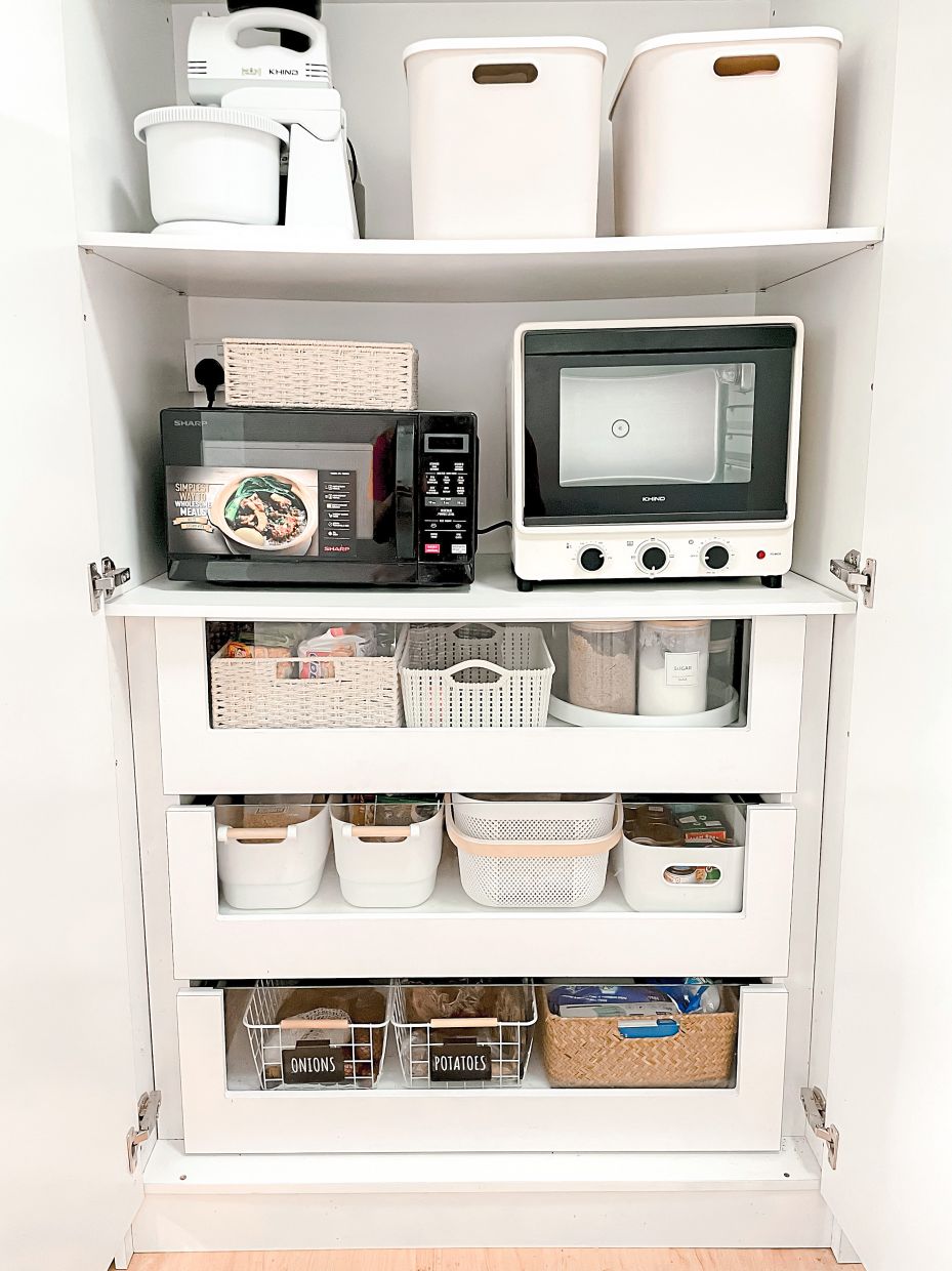 The glass-front drawers allow Dr Izzati to see the items inside easily and help her organise things better.