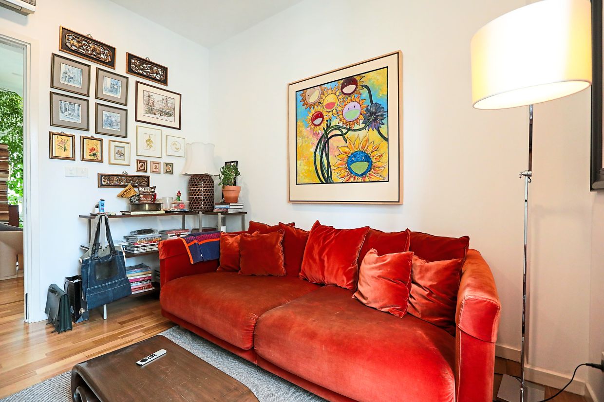 A plush sofa creates an inviting vibe in the TV room.