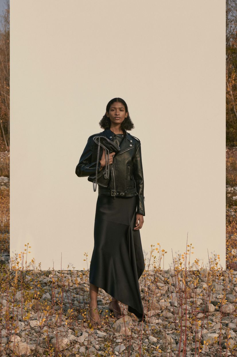 For a cool and classic combo, match a biker jacket with a handkerchief hem skirt. Photo: Stella McCartney