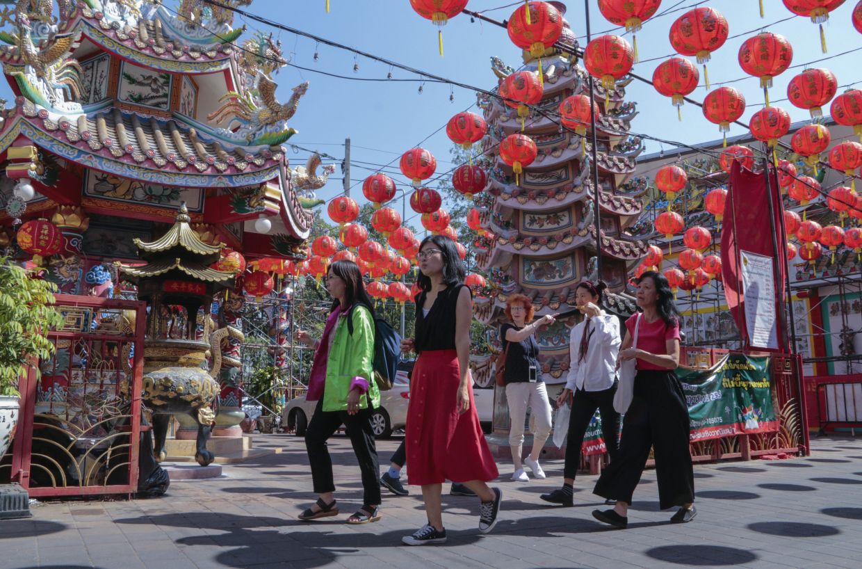 Chinese tourists tour Pung Tao Gong Chinese Temple in Chiang Mai province, northern Thailand. On Thursday, Aug. 10, 2023, China increased the number of countries that its big-spending tourists can visit by more than 70 following the lifting of its last Covid-19 travel restrictions. - AP