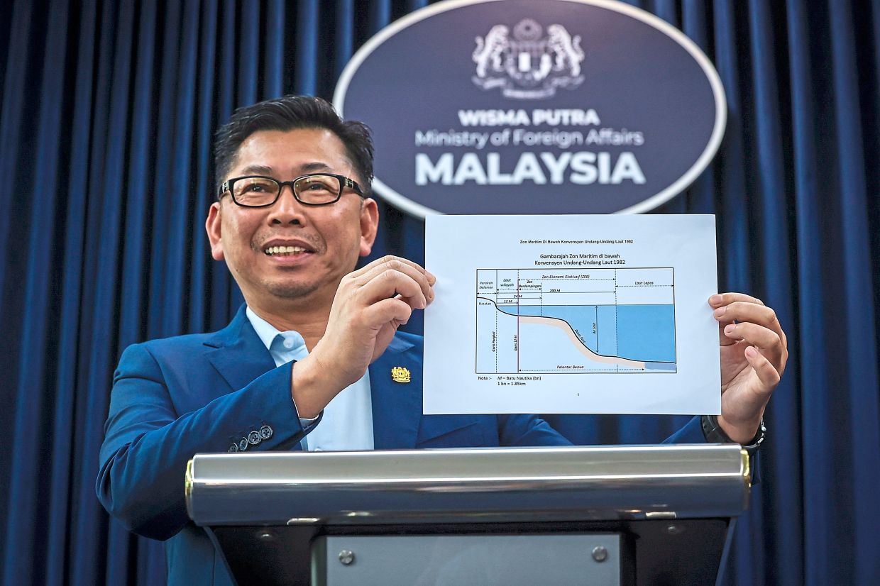 It’s like this: Deputy Foreign Minister Datuk Mohamad Alamin clarifying the Ambalat issue at a press conference in Putrajaya on Aug 15. — Bernama