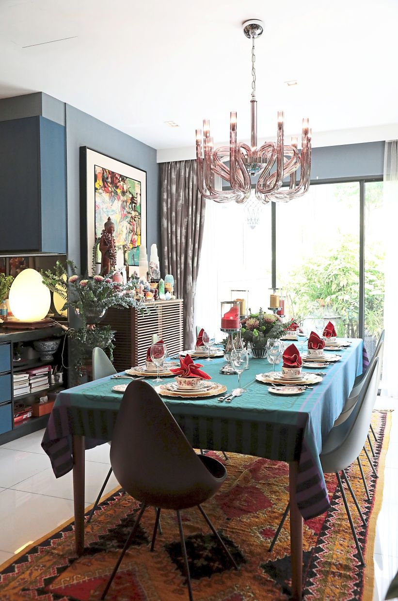The modern dining table and designer Egg chairs seat 10 people comfortably.