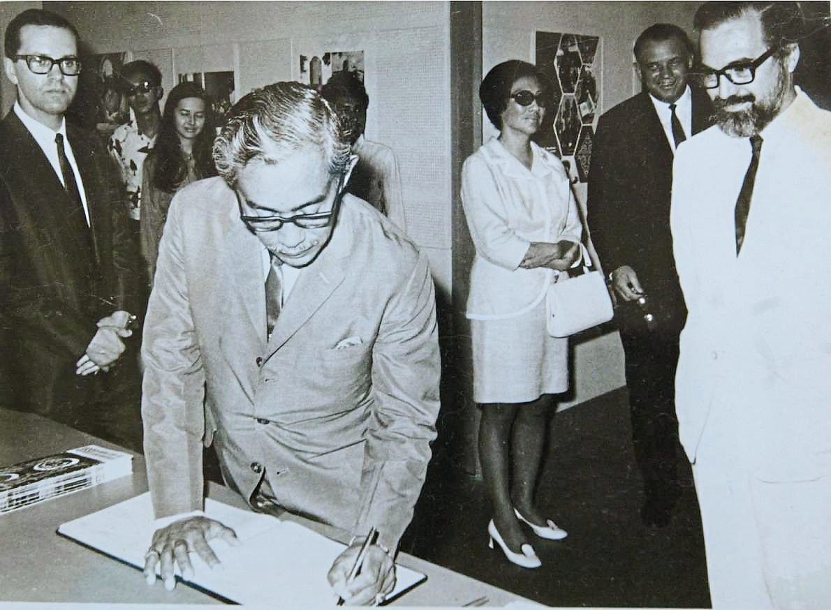Tun Dr Ismail signing a visitor's book. — Filepic/The Star