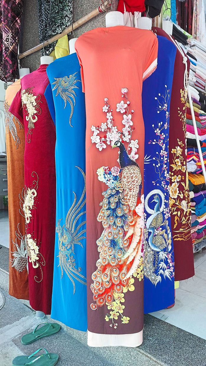 A tailoring shop that makes beautiful traditional Vietnamese costumes in Cam Duc.