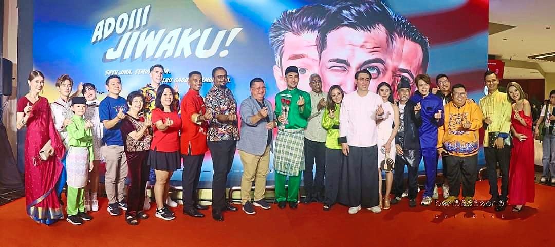 'Adoiii Jiwaku' film's director Steve Yap (middle green) and executive producer Chris Daniel Wong with the cast and production crew during a recent gala night screening at TGV cinema in Pavilion Bukit Jalil, Kuala Lumpur.