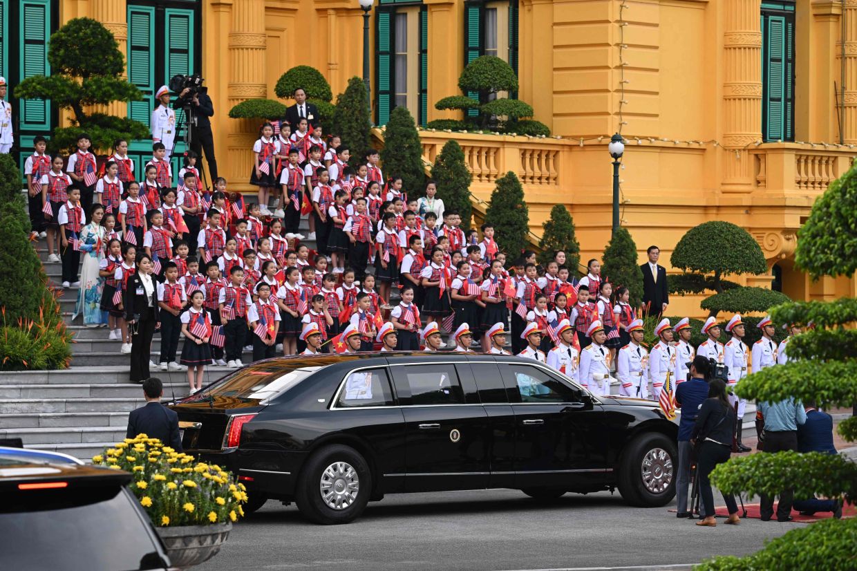 The car carrying US President Joe Biden is seen as he arrives for a welcoming ceremony at the Presidential Palace of Vietnam in Hanoi on Sunday, September 10, 2023. Biden travels to Vietnam to deepen cooperation between the two nations, in the face of China's growing ambitions in the region. - AFP