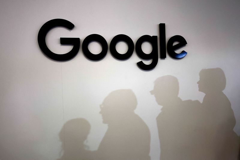 Visitors cast their shadows past the logo of Google at the Viva Technology conference dedicated to innovation and startups at Porte de Versailles exhibition center in Paris France June 15 2023. REUTERSGonzalo Fuentes