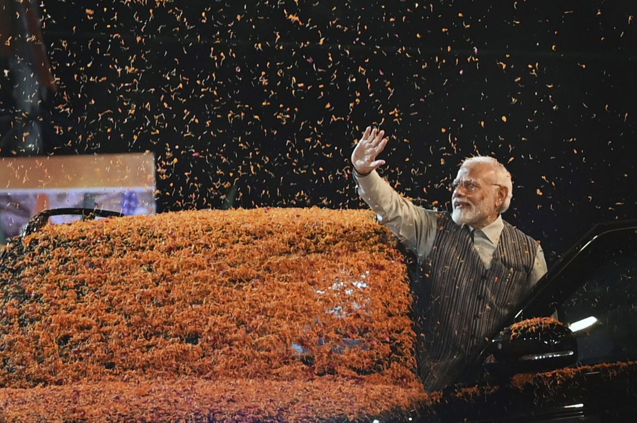 Indian Prime Minister Narendra Modi waves at the crowd as he arrives to attend the Central Election Committee meeting at the headquarters of the Bharatiya Janata Party in New Delhi, India, Wednesday, Sept 13, 2023. He was felicitated by his party members for the successful completion of the G20 summit in India. - AP