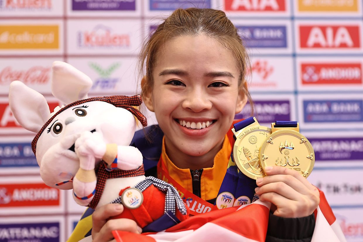 With her two gold medals.