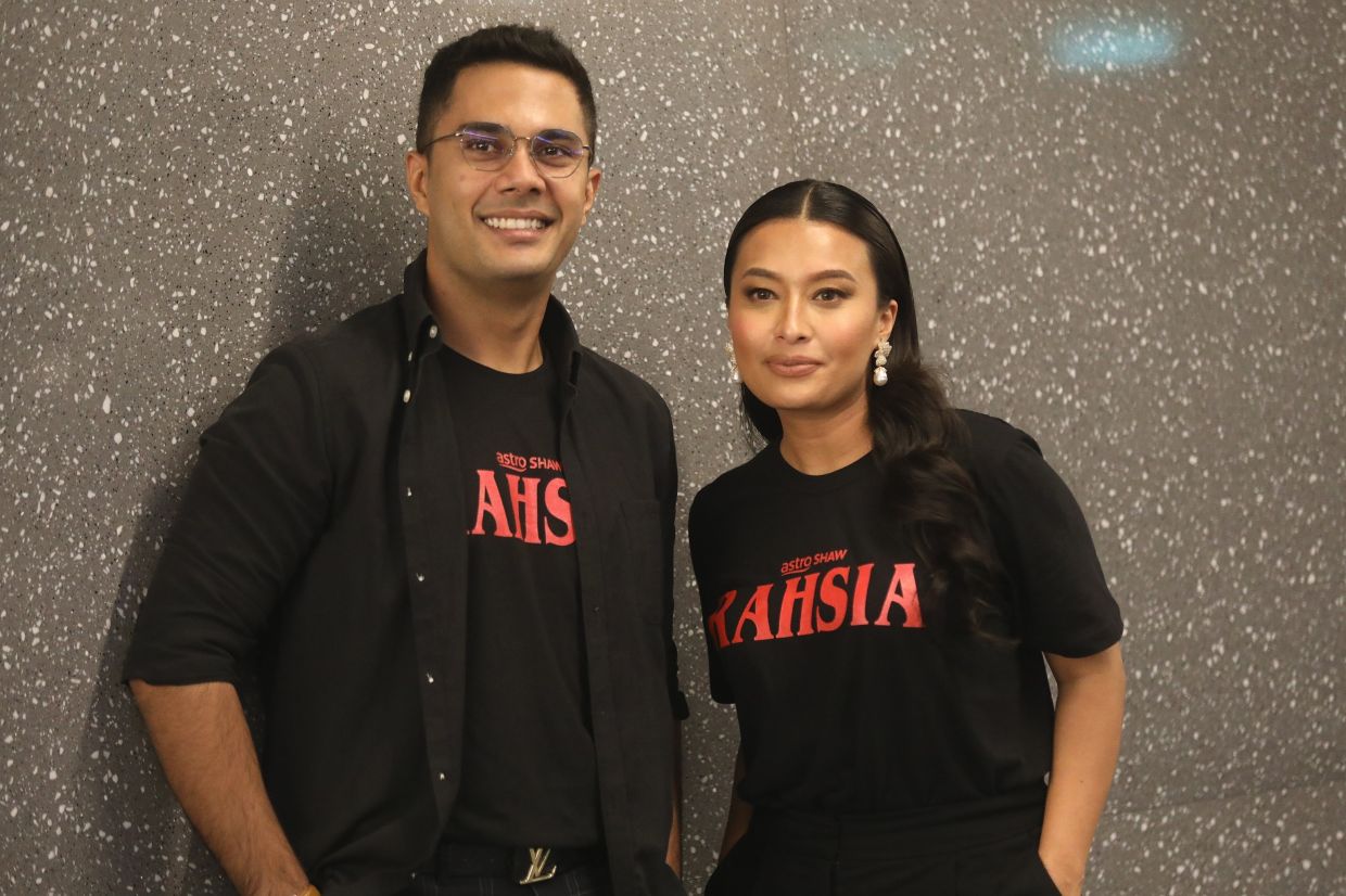 Fikry Ibrahim with co-star Nabila Huda during a press conference for the film Rahsia. Photo: SHAARI CHEMAT /The Star