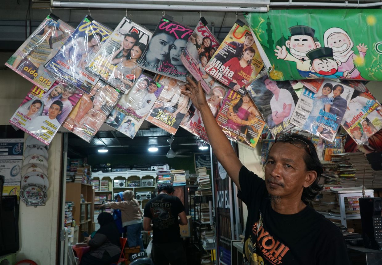 Apart from literary titles and rare books, Amir Hamzah says there is a growing demand for local pop culture nostalgia, with vintage entertainment magazines and comics fetching collector prices. Photo: Bernama 