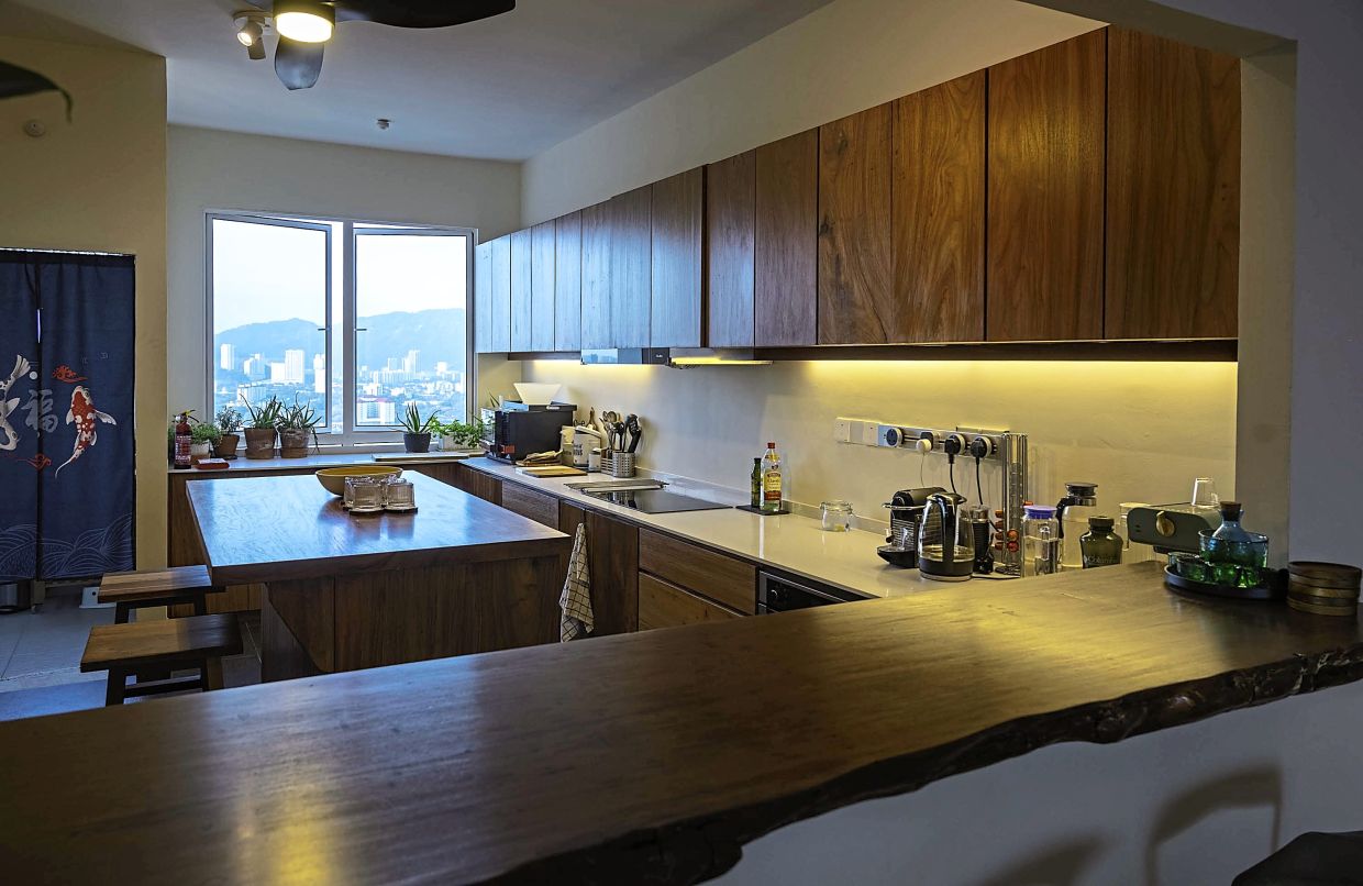 The wood for the kitchen cabinets and island was salvaged from trees that fell during thunderstorms.