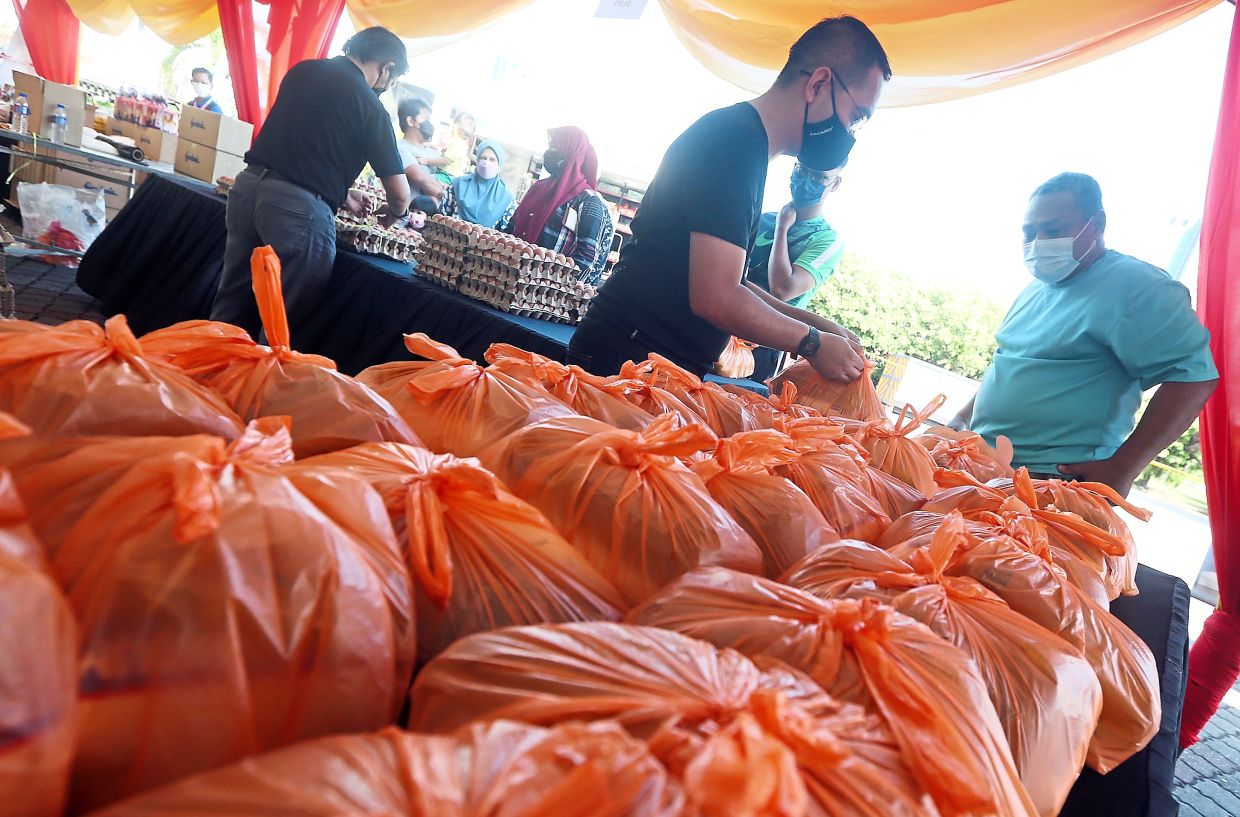 The government has launched several initiatives to address rising living costs, such as the Rahmah Sales whereby chicken was sold at RM10 per bird. – IZZRAFIQ ALIAS/The Star