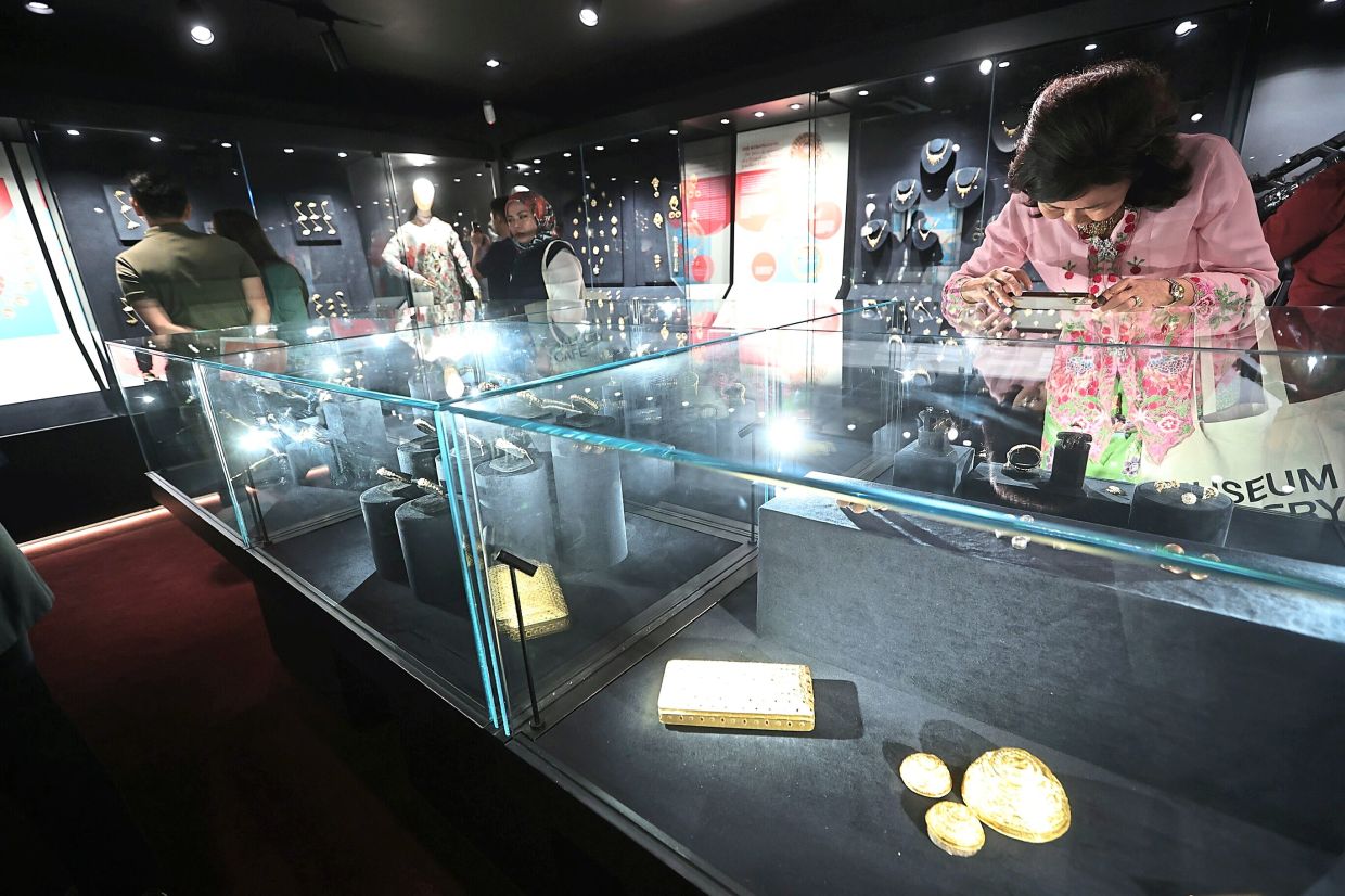 Visitors exploring the different jewellery exhibits - dating back to the 1800s - at the museum in Ampang, Selangor. Photo: The Star/Azman Ghani