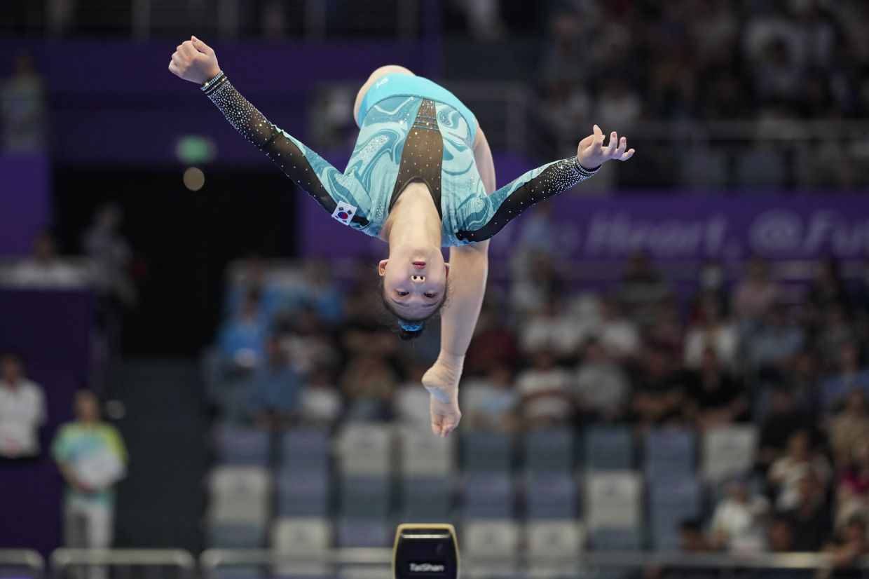 Yun Boeun of South Korea performs on the balance beam at the women's team artistic gymnastics event of the 19th Asian Games in Hangzhou, China, Monday, Sept. 25, 2023. - AP