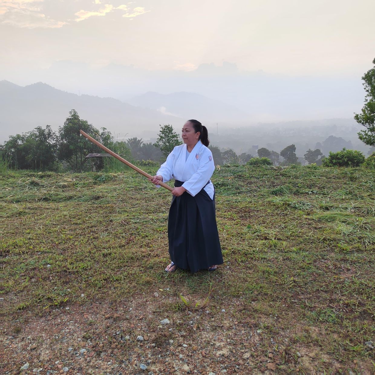 Raja Sazita during an Bokken training during sun rise during a two-day day camp recently. - Photo: RAJA SAZITA SIFFUDIN
