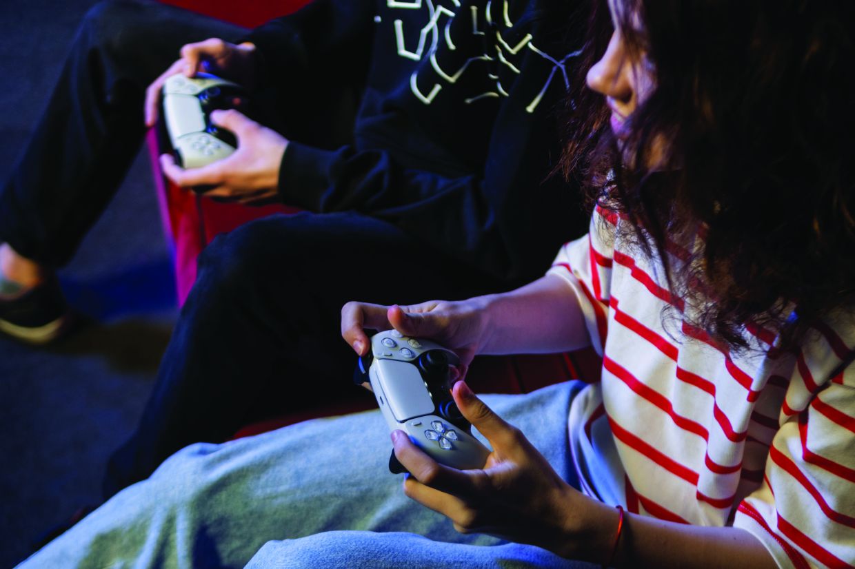 The couple that games together, stays together. — Pexels.com