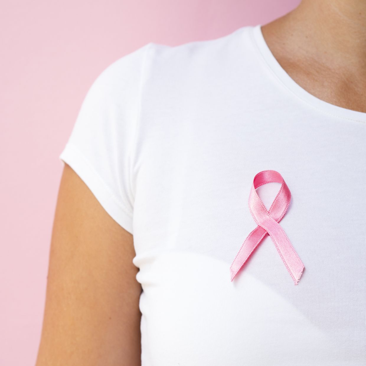 The pink ribbon represents a shared sense of hope and solidarity In the battle against breast cancer.