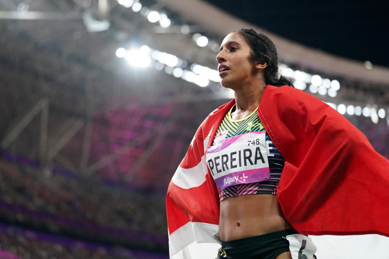 Singapore's Veronica Shanti Pereira poses after winning the Women's 200m final at the Asian Games in Hangzhou on Monday (Oct 2, 2023) - Sport Singapore via REUTERS/Bryan Foo