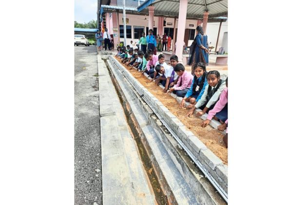From seeds, we grow: Students at a school in Pulau Carey, Selangor preparing their plot to plant seeds. Getting children involved can help raise awareness of the need for agriculture.