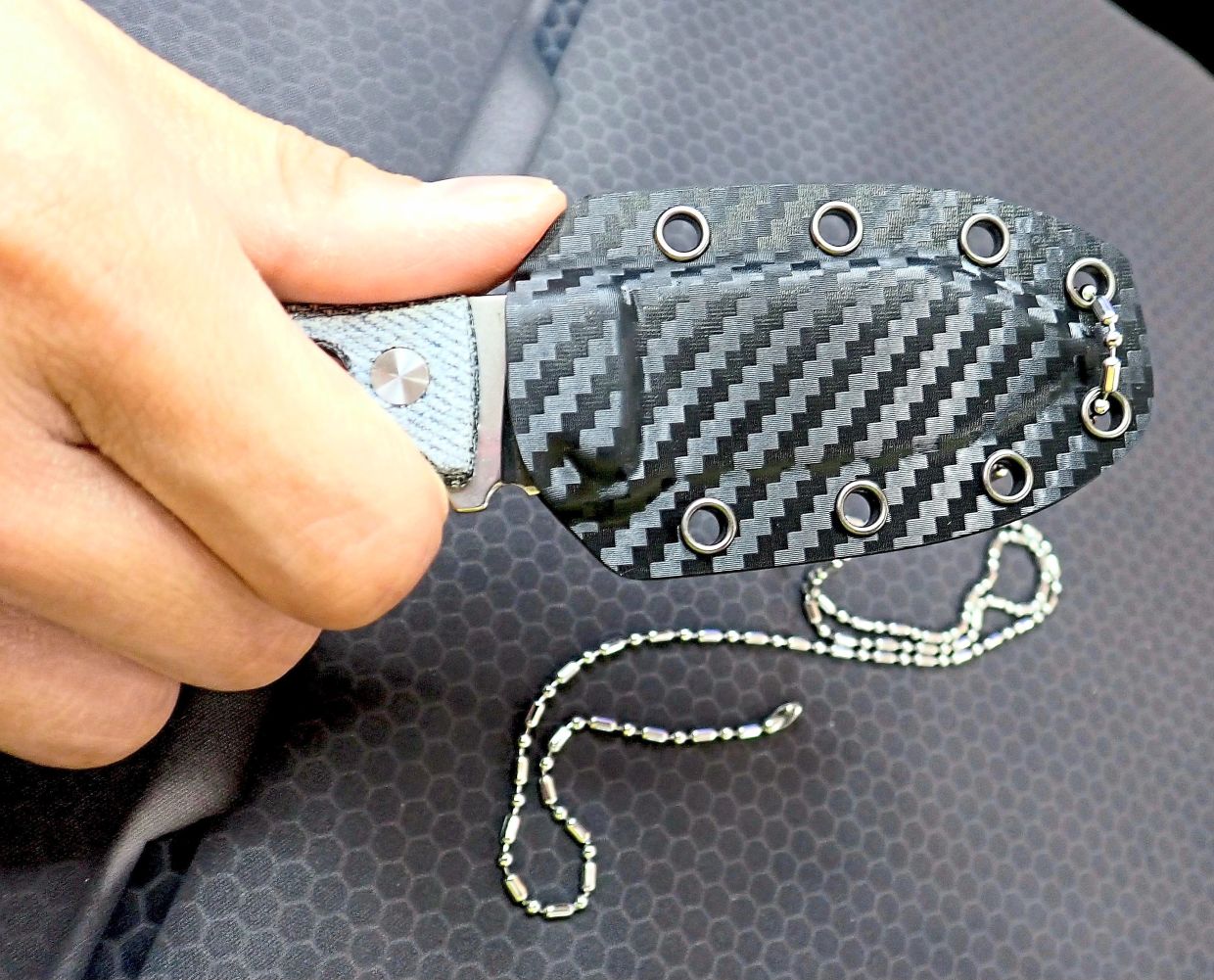 Neck knife sheaths with thumb ramps make it easy to free the blade from the sheath by just pressing on the ramp a little.