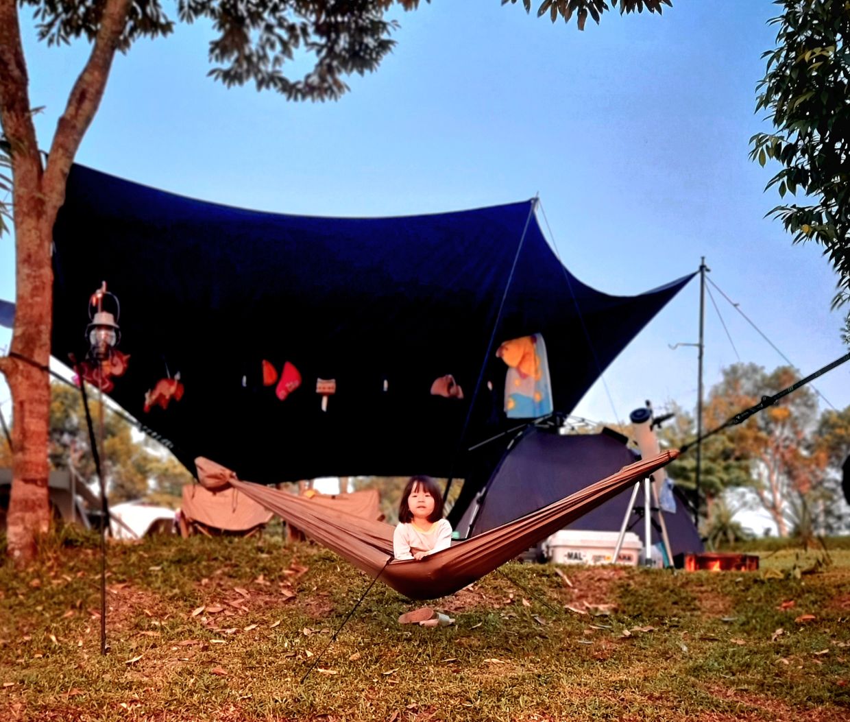 Kyla waking early and clambering into the camp hammock to watch the sunrise.