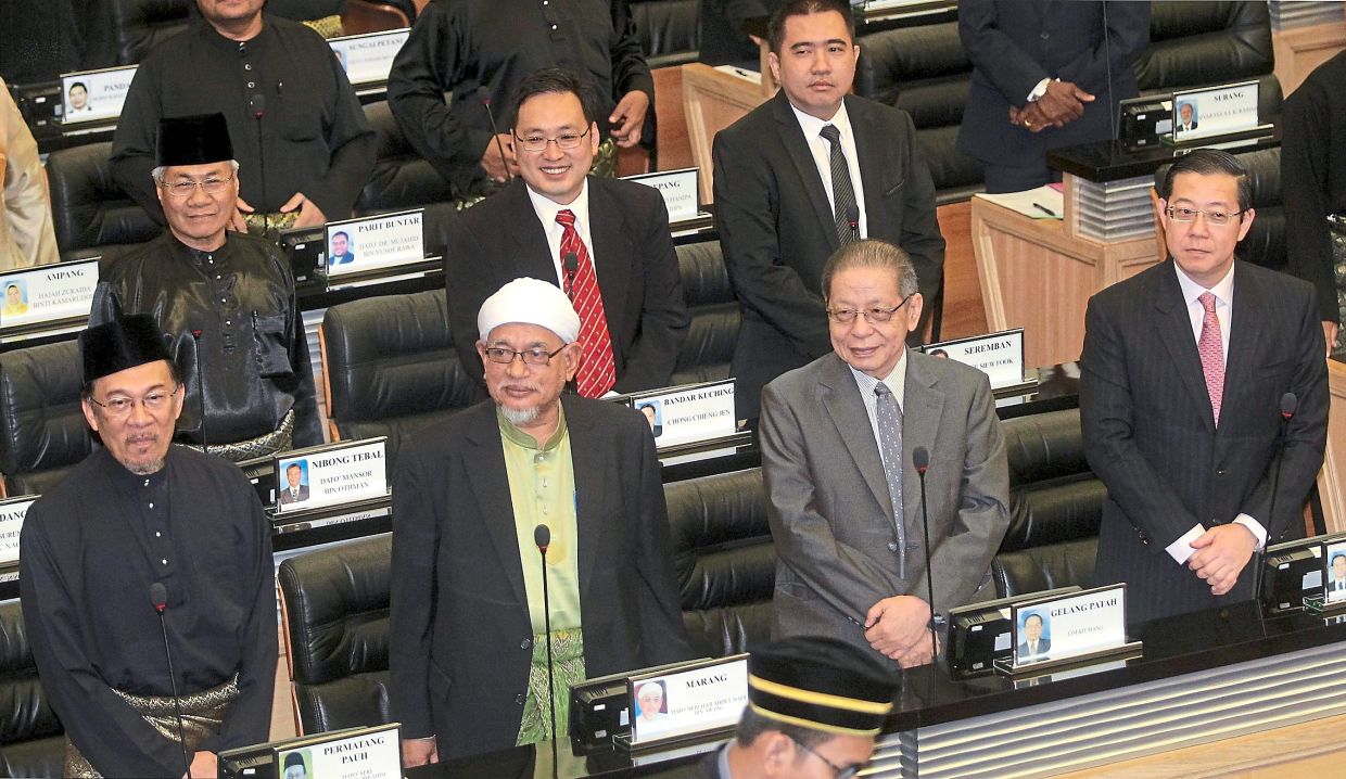 Back in the day: (From left) Anwar, PAS leader Datuk Seri Abdul Hadi Awang, DAP’s Lim Kit Siang and Lim Guang Eng during the swearing-in ceremony of MPs in Parliament in June 2013. PKR, DAP and PAS formed a strong Opposition bloc then because they had similar political goals: to push back Umno and Barisan Nasional during the 2013 General Election. — Filepic/The Star