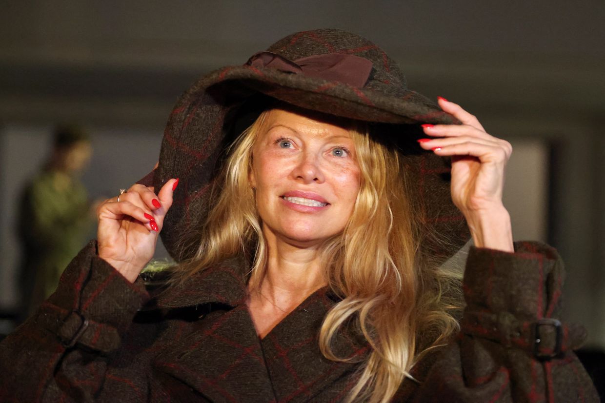 Pamela Anderson made her recent Paris Fashion Week rounds with no makeup on. Photo: Reuters