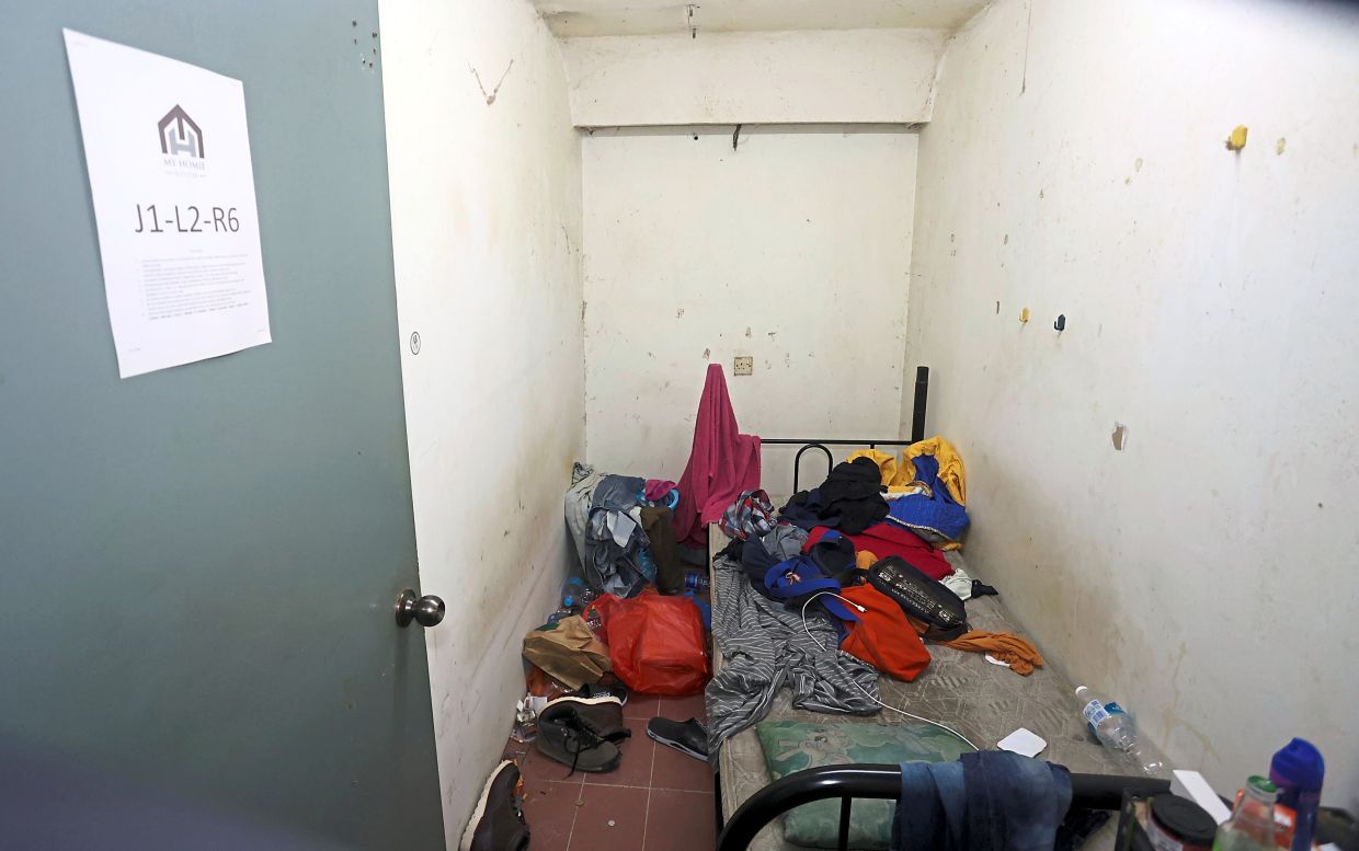 Inhumane conditions: One of the rooms in the three-storey shoplot in Taman Maluri, Cheras, that was raided last week.