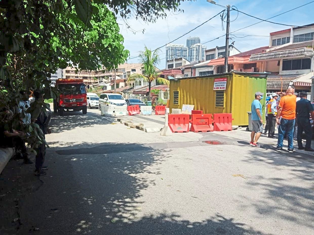 A photo of the container Lim placed on the road in front of his house as a mark of protest last year. — Filepic