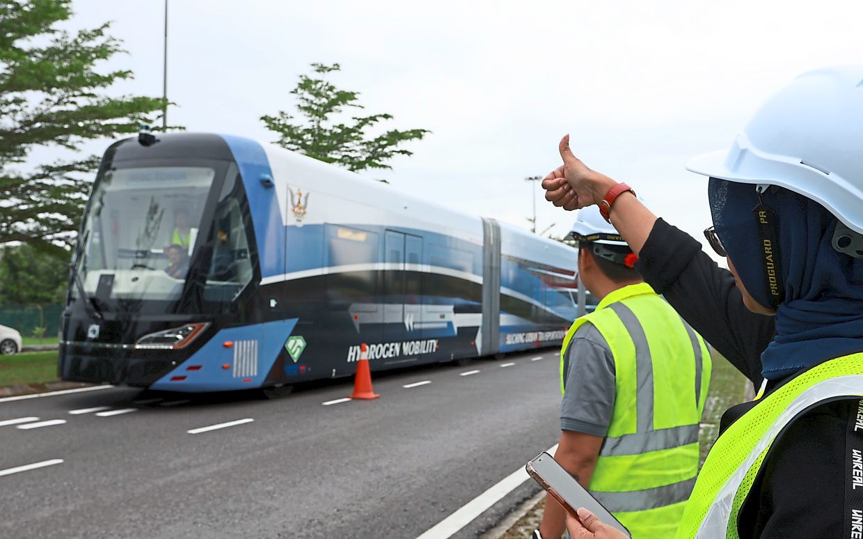 The prototype ART hydrogen vehicle on a test run in Kuching, Sarawak. — Filepic