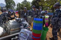 Aid trickles in to Nepal villages struck by earthquake as survivors salvage belongings from rubble