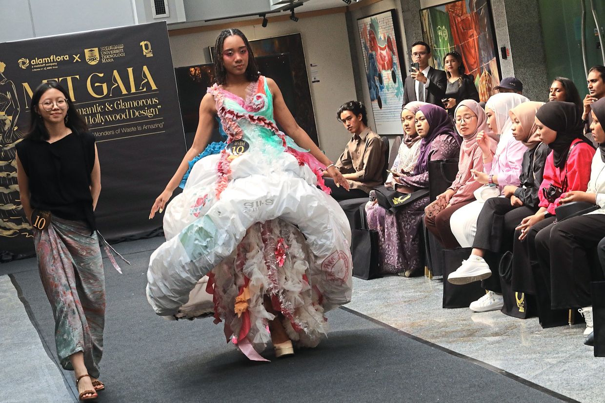 Designer Sky Lau Yiet Kuan presenting ‘The Jellyfish’ concept dress alongside her model.