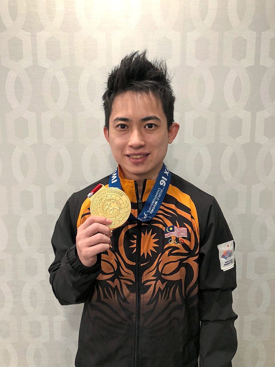 Posing with his top prize.