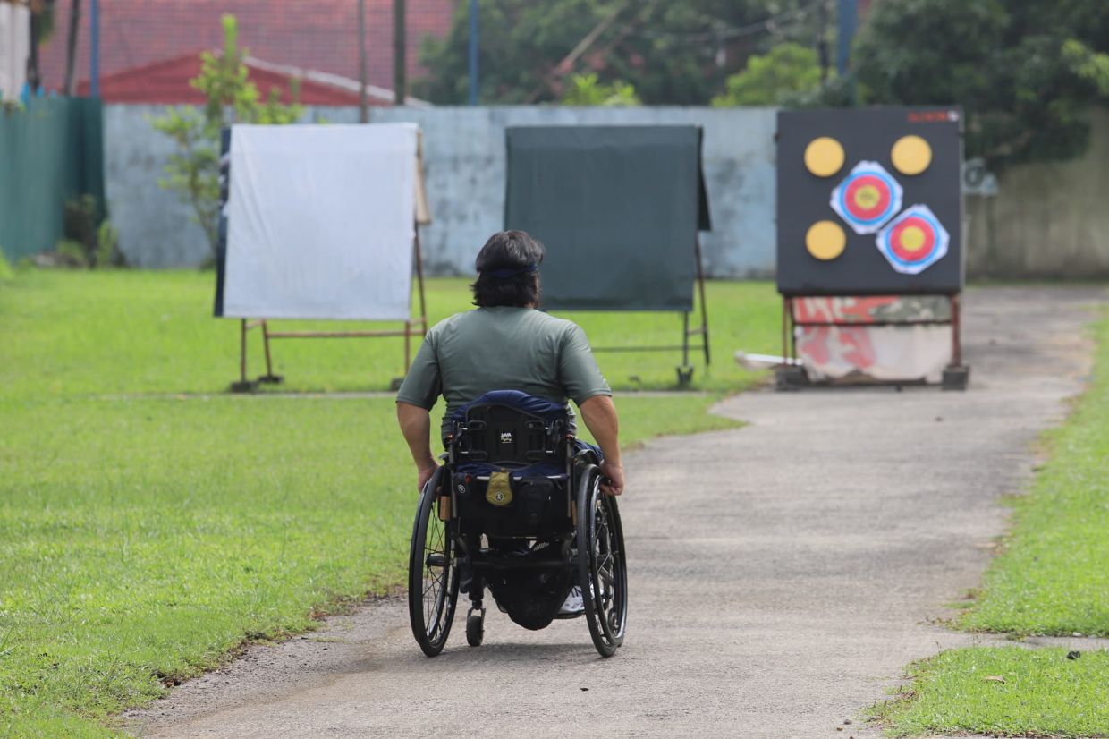 The free-spirited archer is entirely independent, seen here collecting his arrows after sending them downrange.